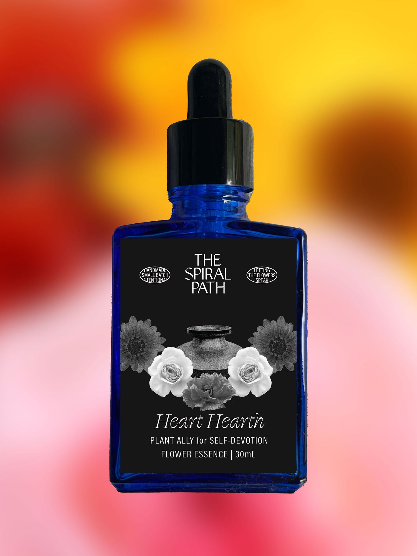 Small batch organic flower essence - feminine healing, 15mL, blue glass bottle with dropper. This essence supports emotional healing and is a sensitive medicine for sensitive people. Heart Hearth flower essence is a plant ally for self-devotion. Poppy, Rose, Calendula.