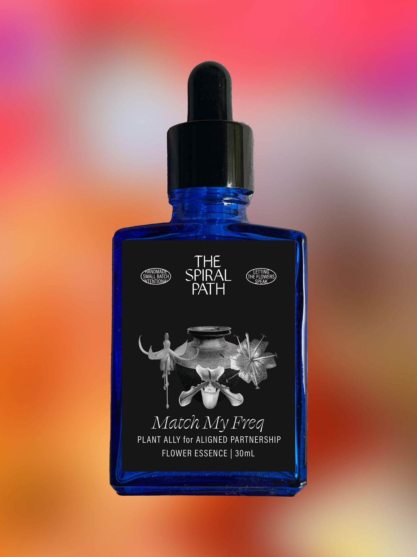 Small batch organic flower essence - feminine healing, 15mL, blue glass bottle with dropper. This essence supports emotional healing and is a sensitive medicine for sensitive people. Match My Freq flower essence is a plant ally for aligned partnership. Fuchsia, Lady Slipper, Tiger Lily.