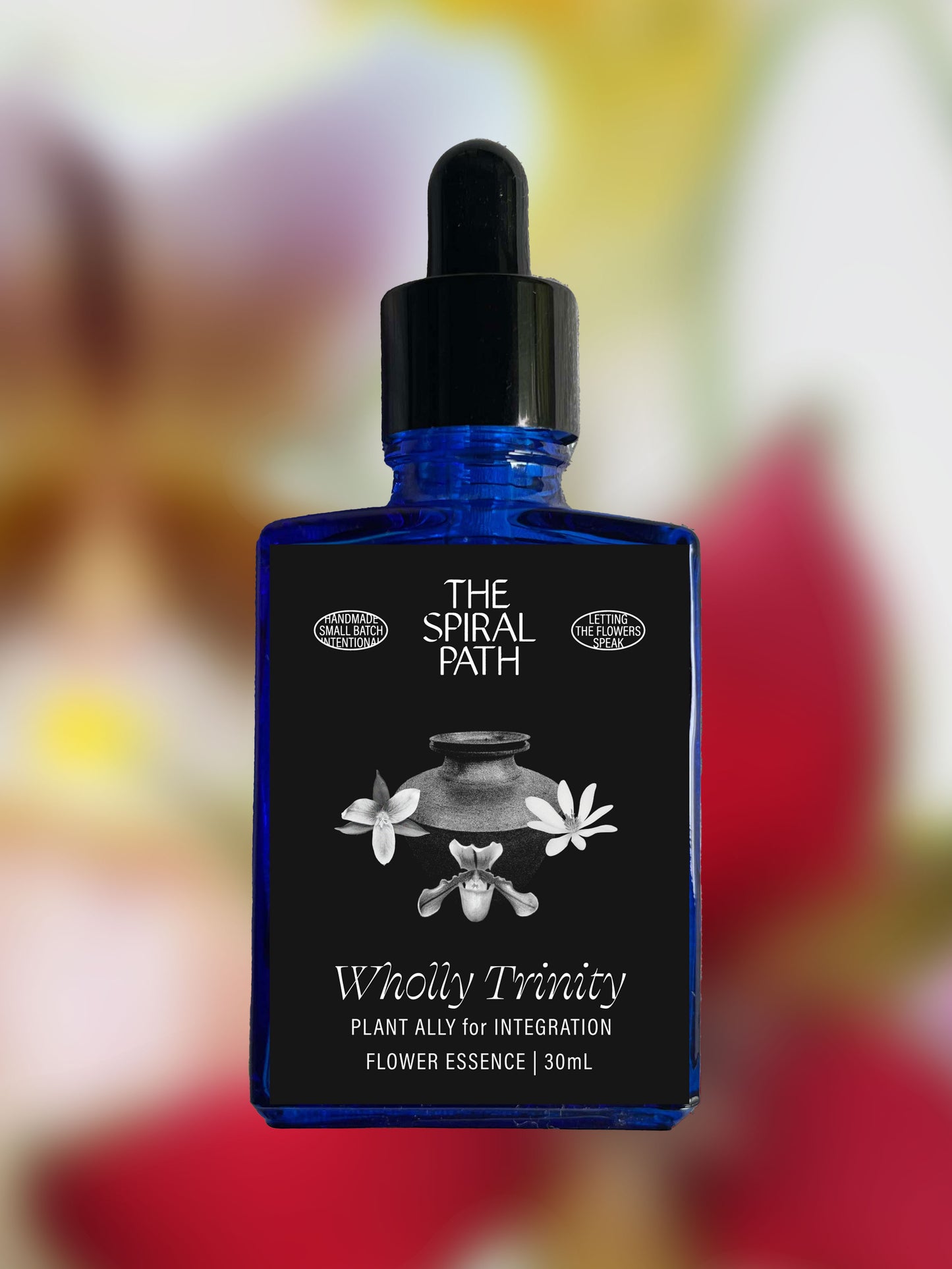 Small batch organic flower essence - feminine healing, 15mL, blue glass bottle with dropper. This essence supports emotional healing and is a sensitive medicine for sensitive people. Wholly Trinity flower essence is a plant ally for integration. Lady Slipper, Trillium, Bloodroot.