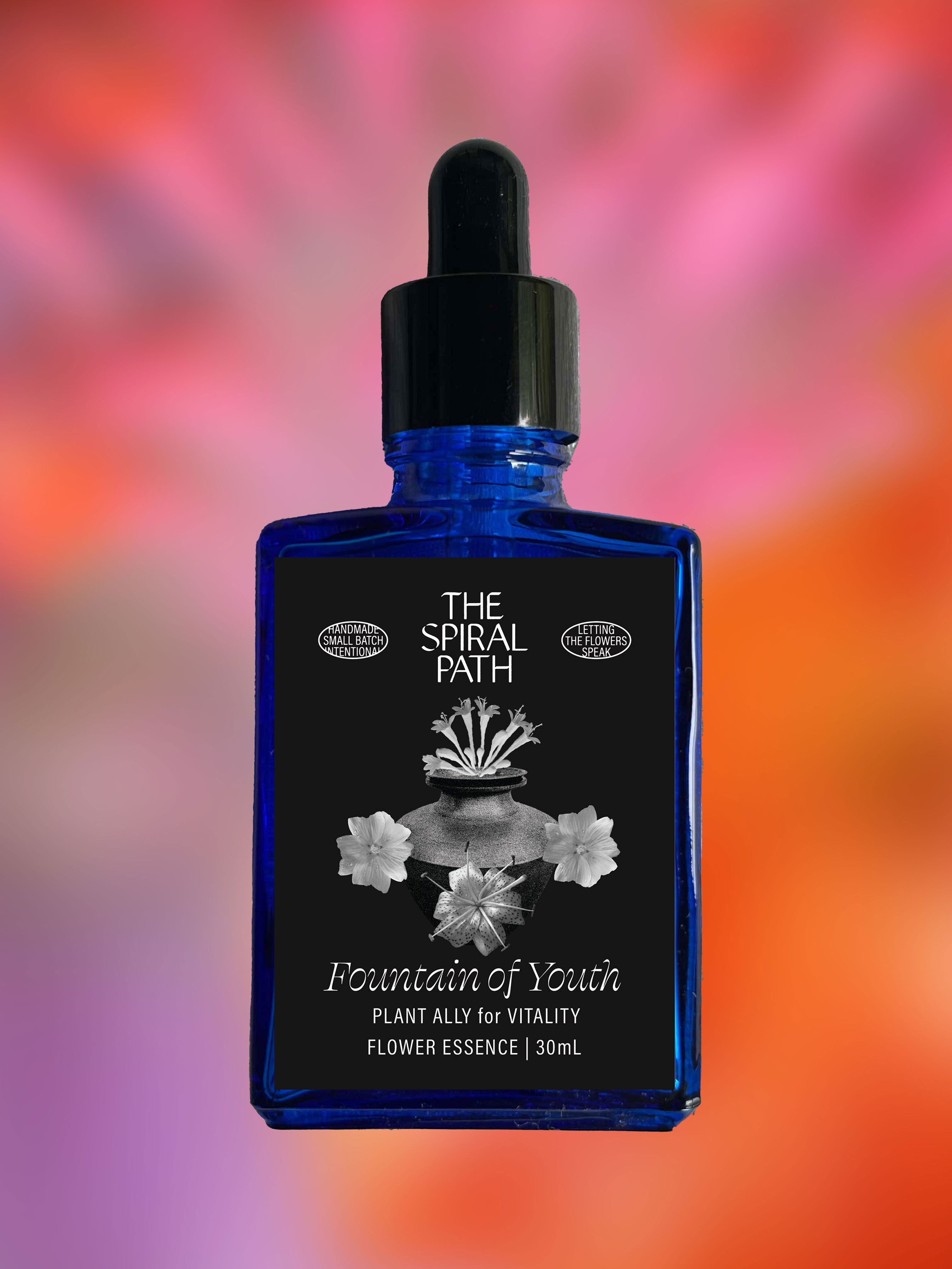 Small batch organic flower essence - feminine healing, 15mL, blue glass bottle with dropper. This essence supports emotional healing and is a sensitive medicine for sensitive people. Fountain of Youth flower essence is a plant ally for vitality. Honeysuckle, Tiger Lily, Mallow. 